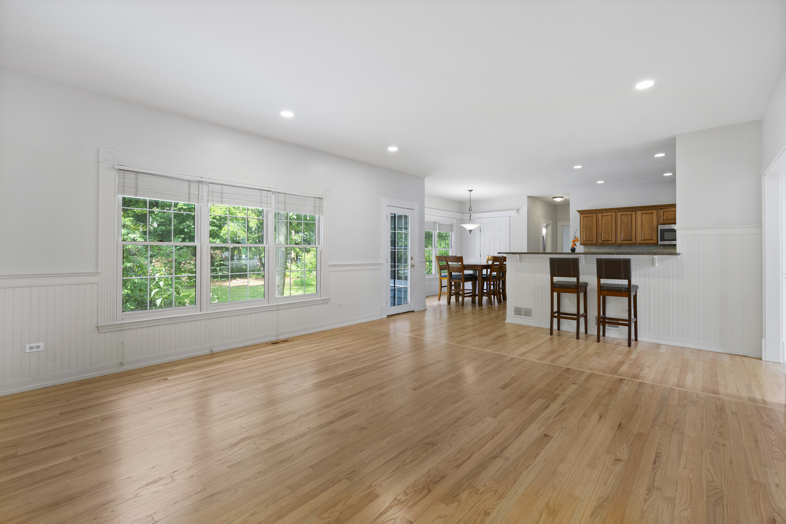 662 Waterbury Avenue Gurnee, IL 60031 - Photo 12 of 51 a view of dining room with furniture and wooden floor