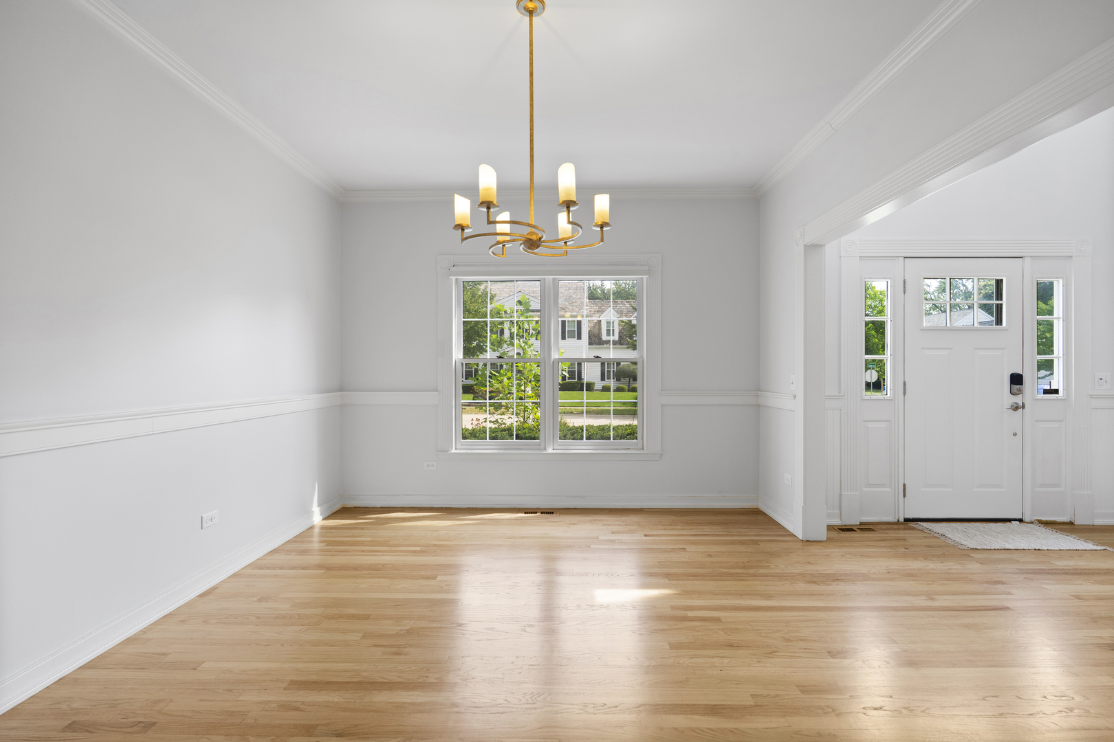 662 Waterbury Avenue Gurnee, IL 60031 - Photo 17 of 51 a view of an empty room with wooden floor and a window
