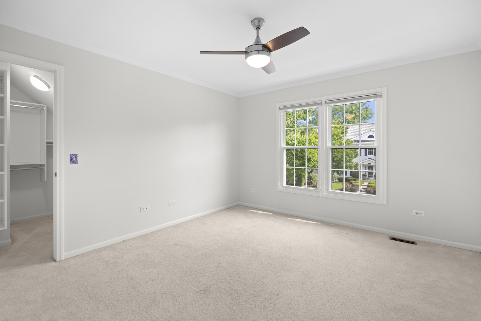 662 Waterbury Avenue Gurnee, IL 60031 - Photo 28 of 51 an empty room with a window and a fan