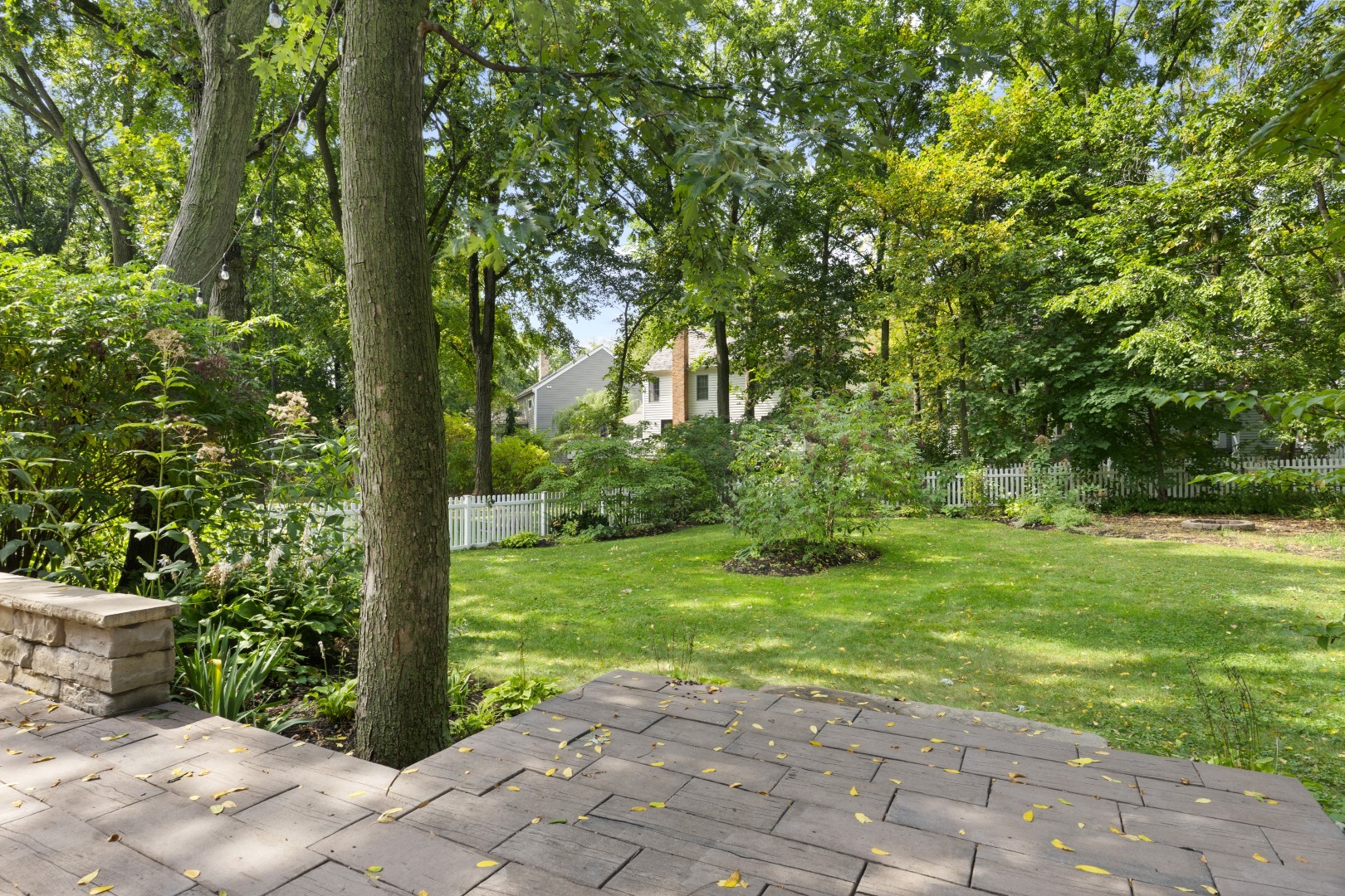 662 Waterbury Avenue Gurnee, IL 60031 - Photo 38 of 51 a view of a yard with plants and large trees