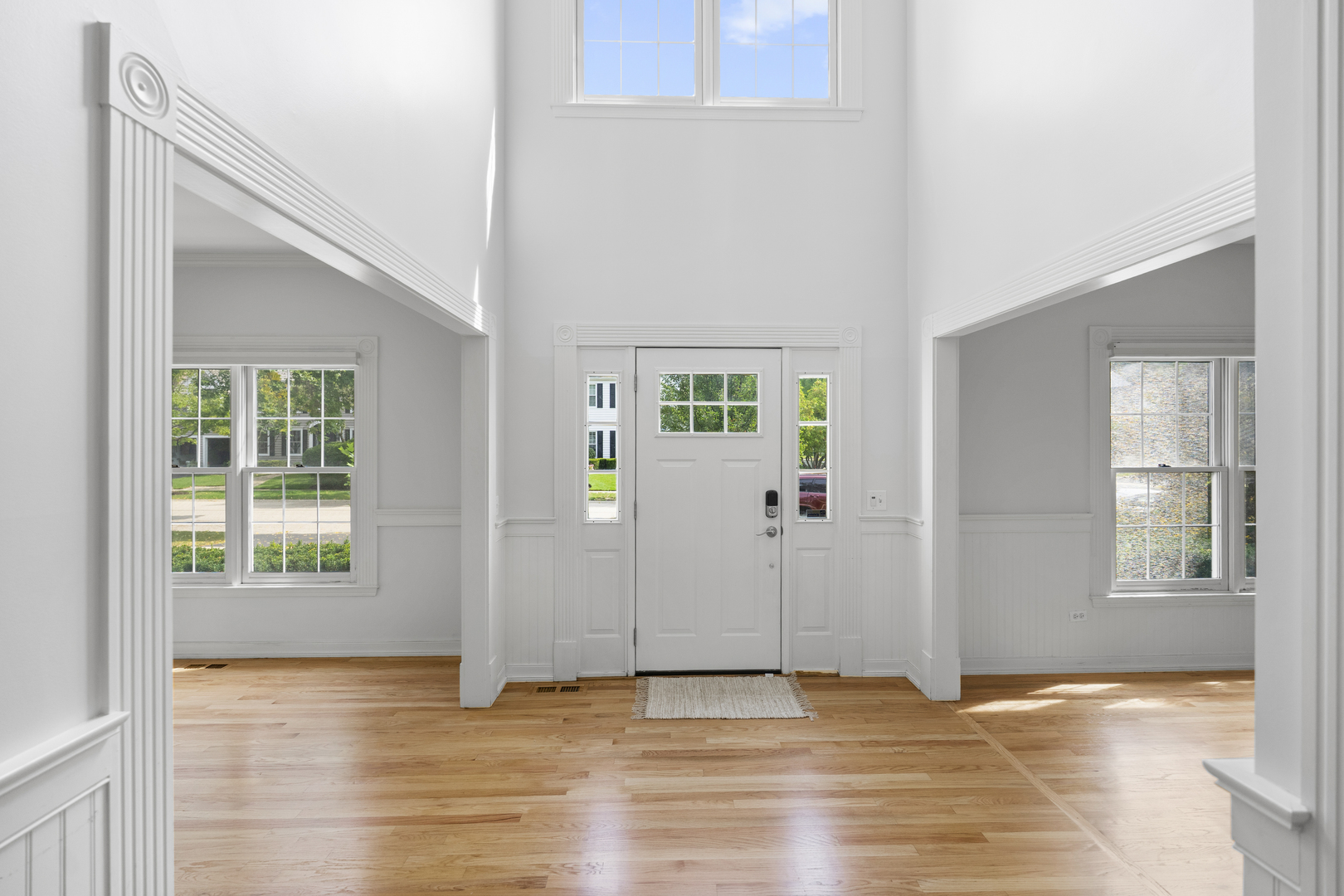 662 Waterbury Avenue Gurnee, IL 60031 - Photo 8 of 51 an empty room with window and wooden floor