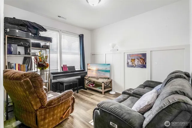 a living room with furniture and a window