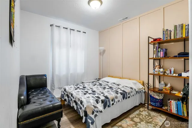 a bedroom with a bed and a closet