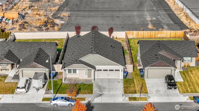 an aerial view of residential houses and street