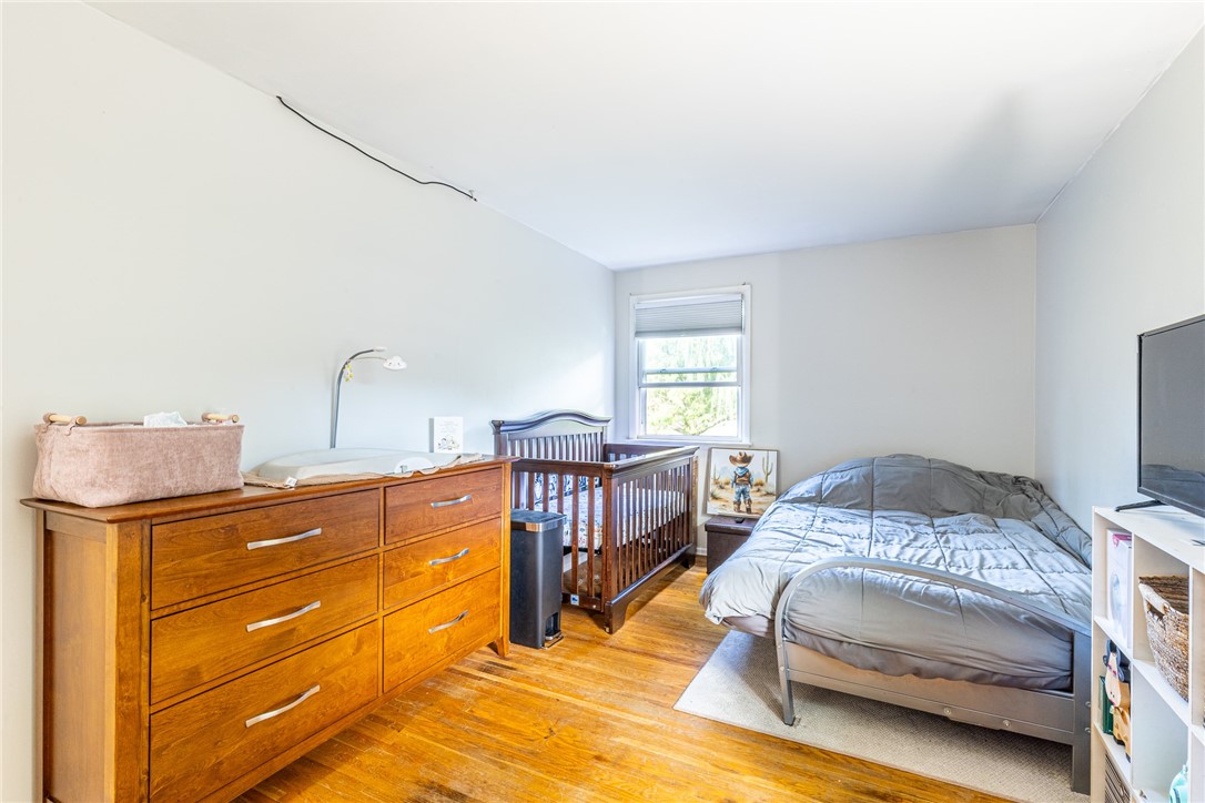 6432 Lakeside Road Ontario, NY 14519 - Photo 19 of 35 Rich hardwood floors anchor this light-filled room with a classic single-hung window.