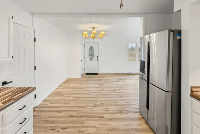 a kitchen with stainless steel appliances granite countertop a refrigerator and microwave