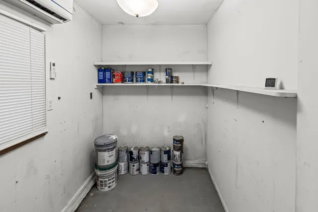 a room with a storage and utility