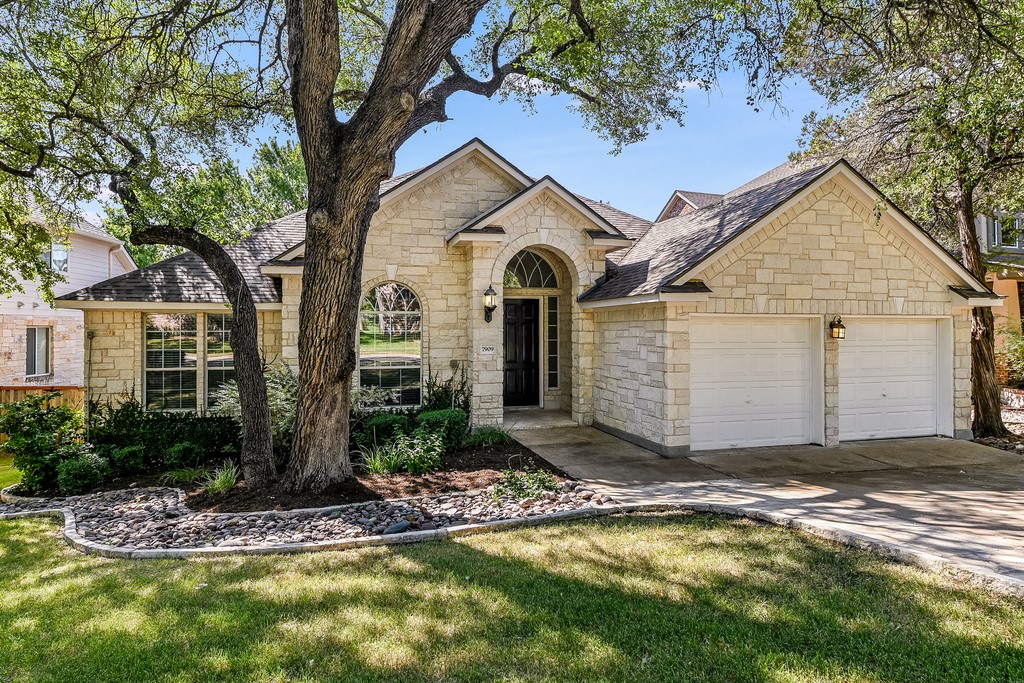 7909 Cobblestone Austin, TX 78735 - Photo 1 of 12 a view of a house with a small yard and large tree