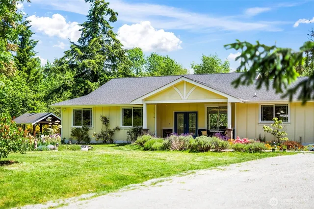 a front view of a house with garden