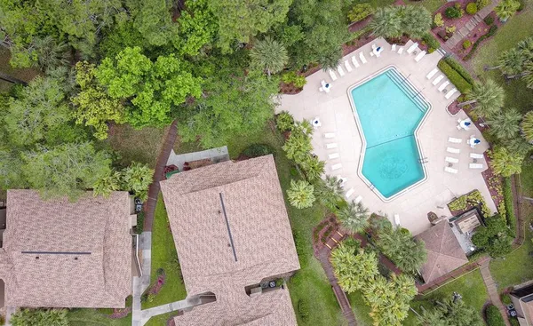 an aerial view of a house with a garden