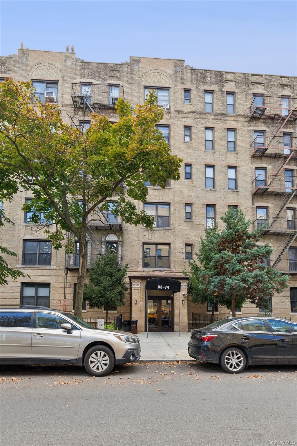 83-74 Talbot Street, Unit 6F Queens, NY 11415 - Photo 12 of 13 a car parked in front of a building