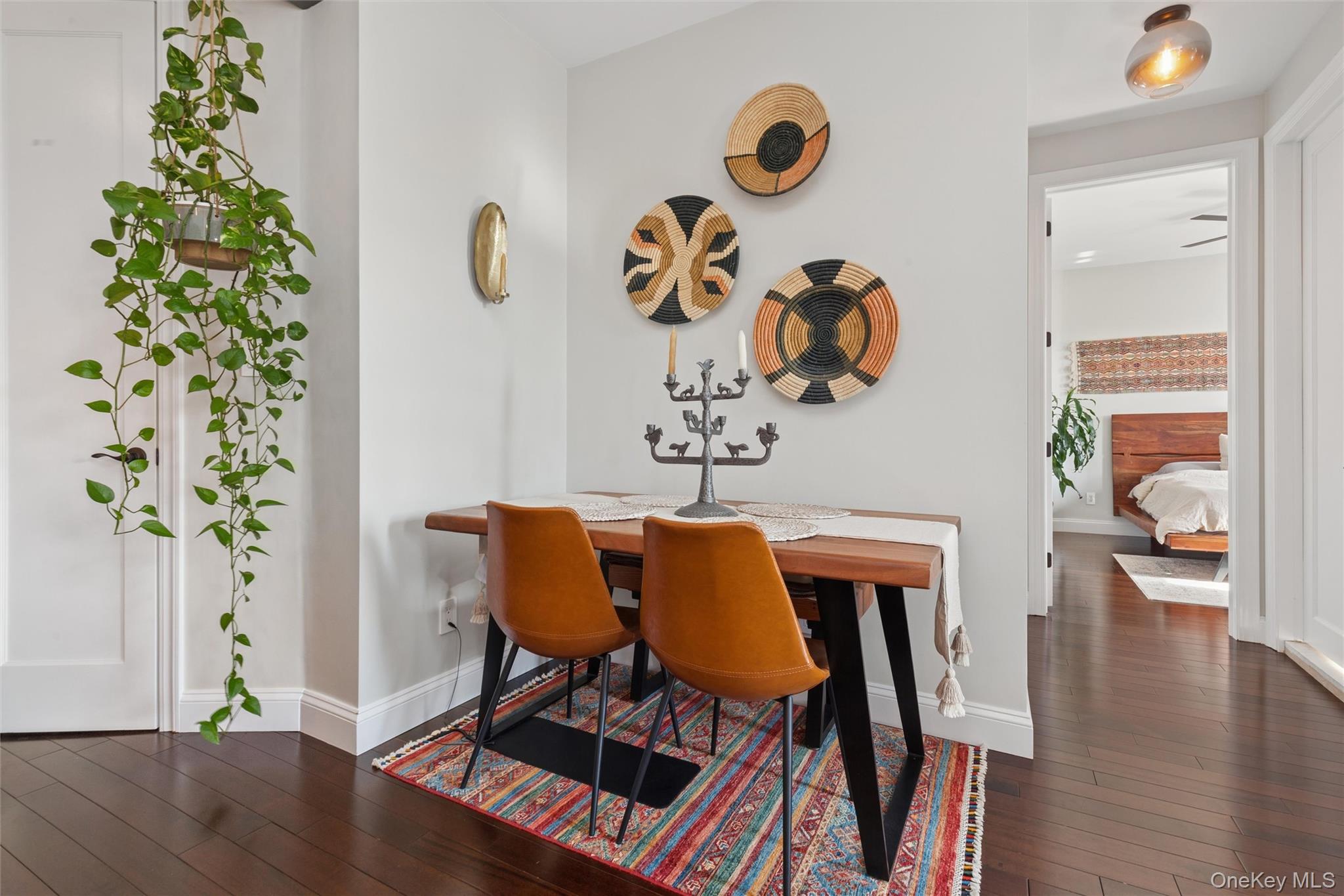 83-74 Talbot Street, Unit 6F Queens, NY 11415 - Photo 9 of 13 a dining room with furniture and wooden floor