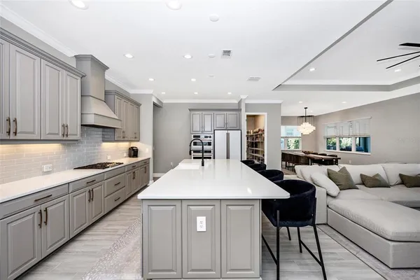 a kitchen with a sink stainless steel appliances and cabinets
