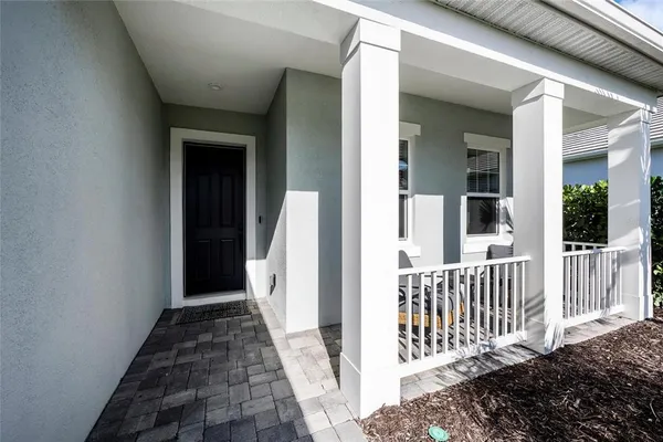 a view of balcony with furniture