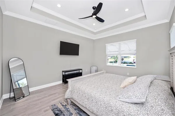a bathroom with a sink toilet vanity and shower