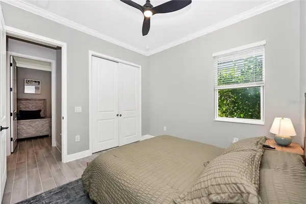 a view of a patio with couches and chairs under an umbrella