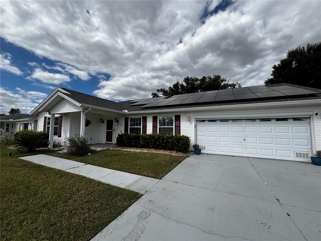 6535 Southwest 84th Place Ocala, FL 34476 - Photo 1 of 1 a front view of a house with a yard and garage