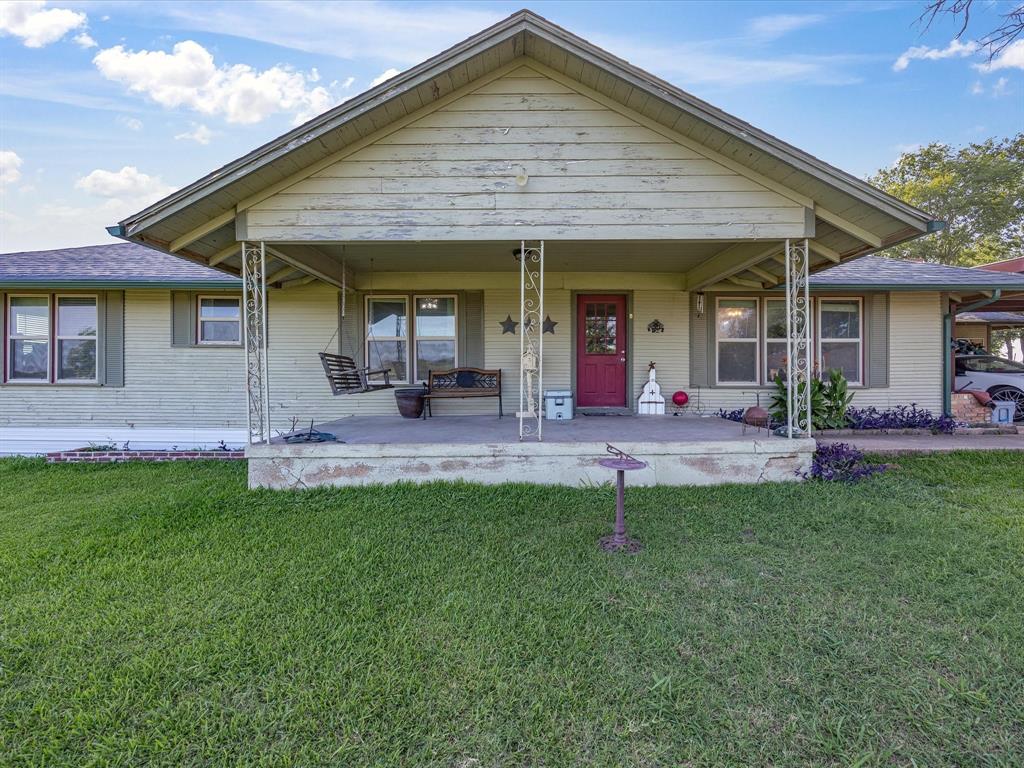 301 Ovilla Road Waxahachie, TX 75167 - Photo 3 of 38 a front view of a house with a yard and outdoor seating