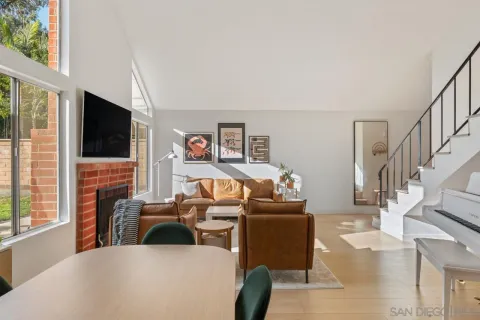 a view of a livingroom with furniture window and wooden floor