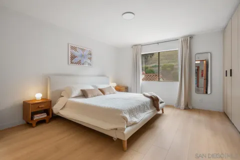 a bathroom with a granite countertop toilet sink and a mirror