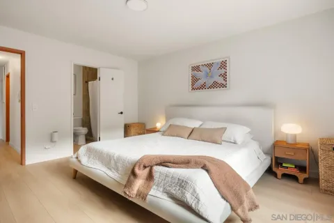 a bathroom with a double vanity sink and mirror