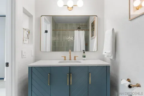 a living room with furniture and a book shelf