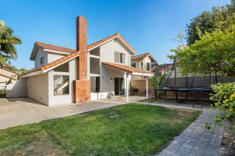 an aerial view of a house with a garden