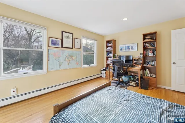a bathroom with a sink a mirror and a shower