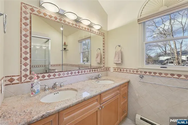 a view of a hallway with workspace and stairs