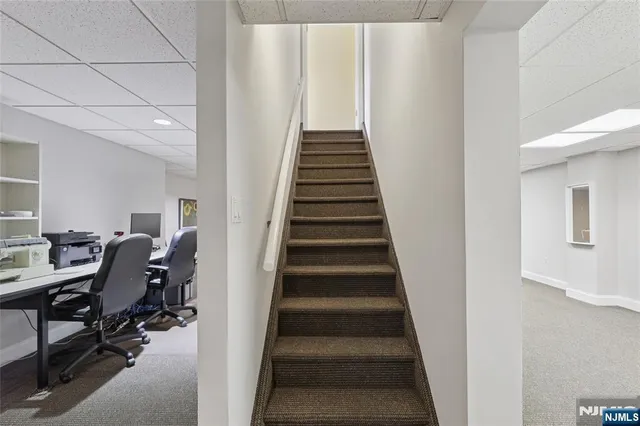 a view of a livingroom with furniture and a ceiling fan