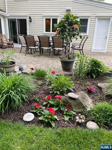 a view of a garden with a patio