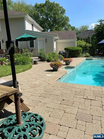 a view of a chair and tables front of the house
