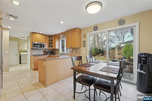 a bathroom with a sink mirror and toilet