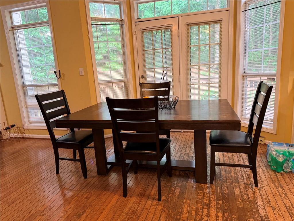 426 Pates Lake Court Hampton, GA 30228 - Photo 13 of 60 a view of a dining room with furniture and wooden floor