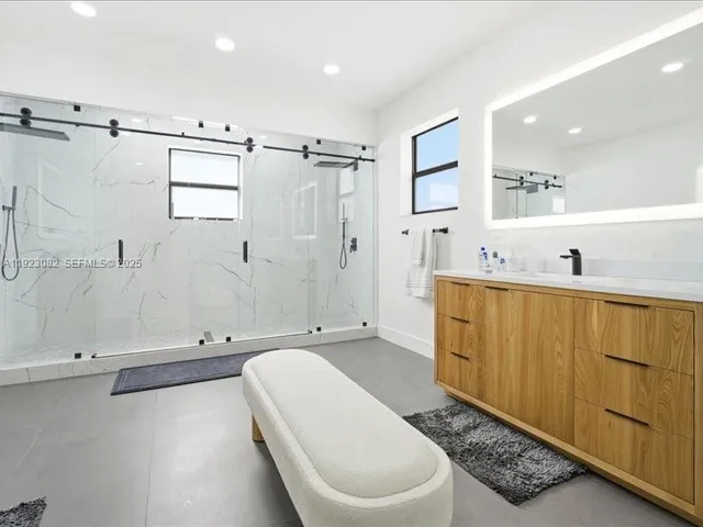 a bathroom with a toilet a sink and bathtub