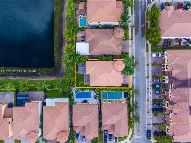 an aerial view of house with a yard