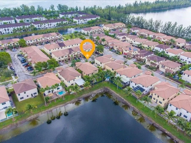 an aerial view of a city with lake view