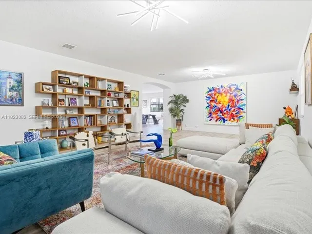 a living room with furniture and a rug
