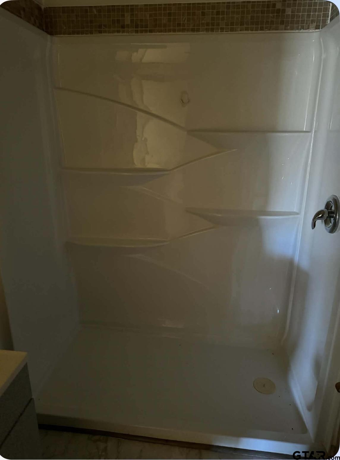 733 Mallory Street Lindale, TX 75771 - Photo 7 of 8 a bathroom with a shower