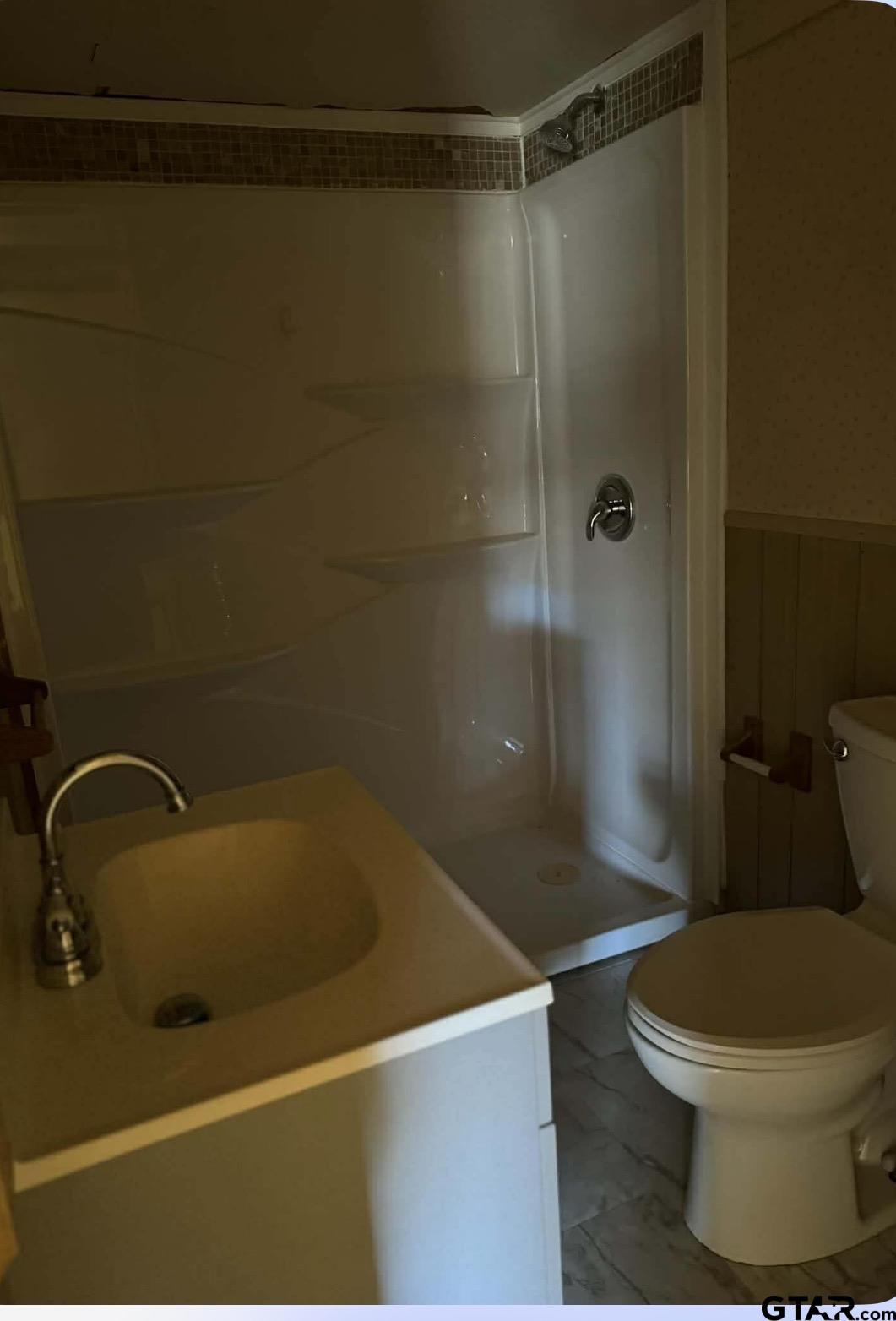 733 Mallory Street Lindale, TX 75771 - Photo 8 of 8 a bathroom with a sink and a toilet