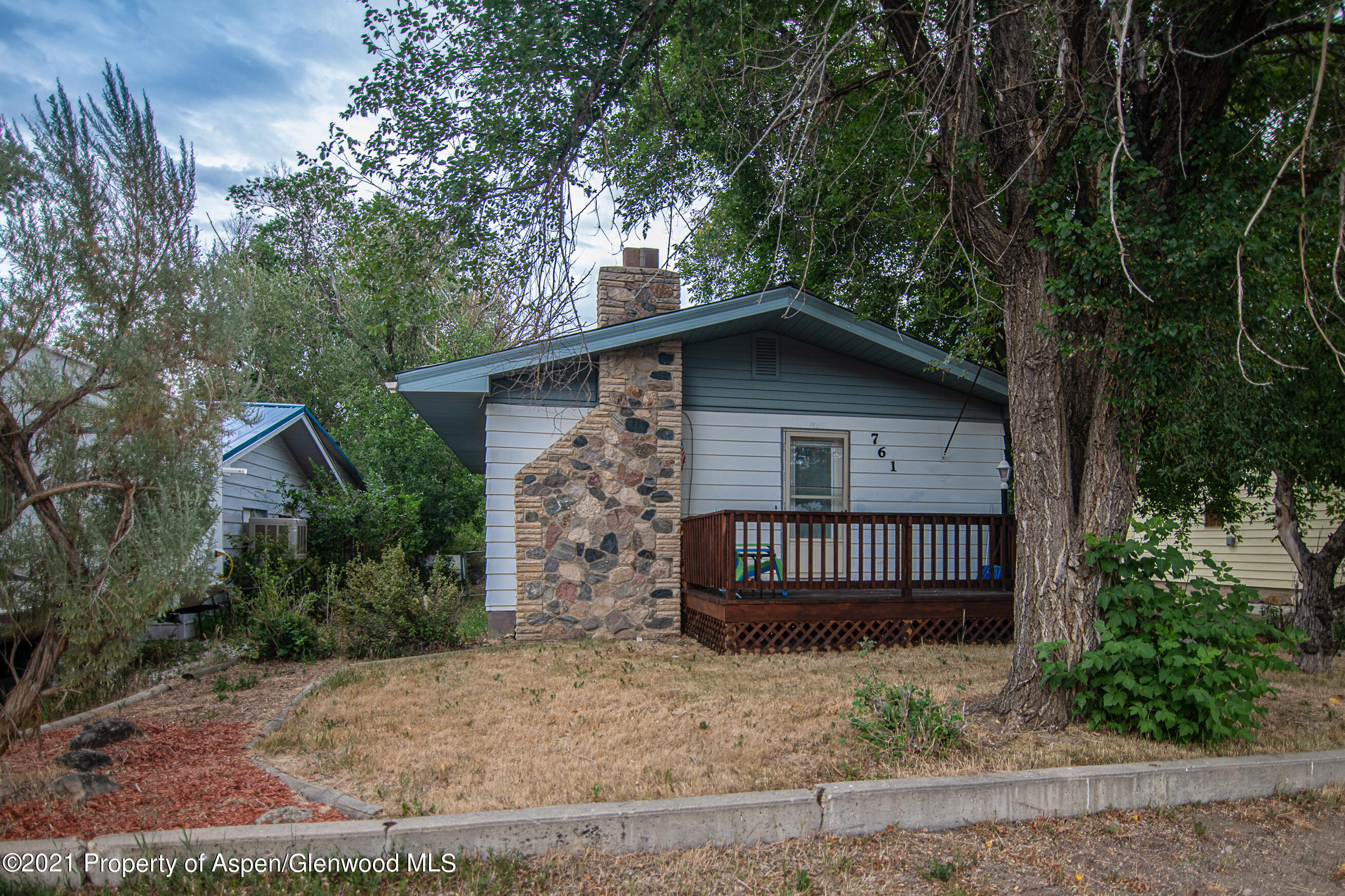 761 Rose Street Craig, CO 81625 - Photo 1 of 42 a front view of a house with garden