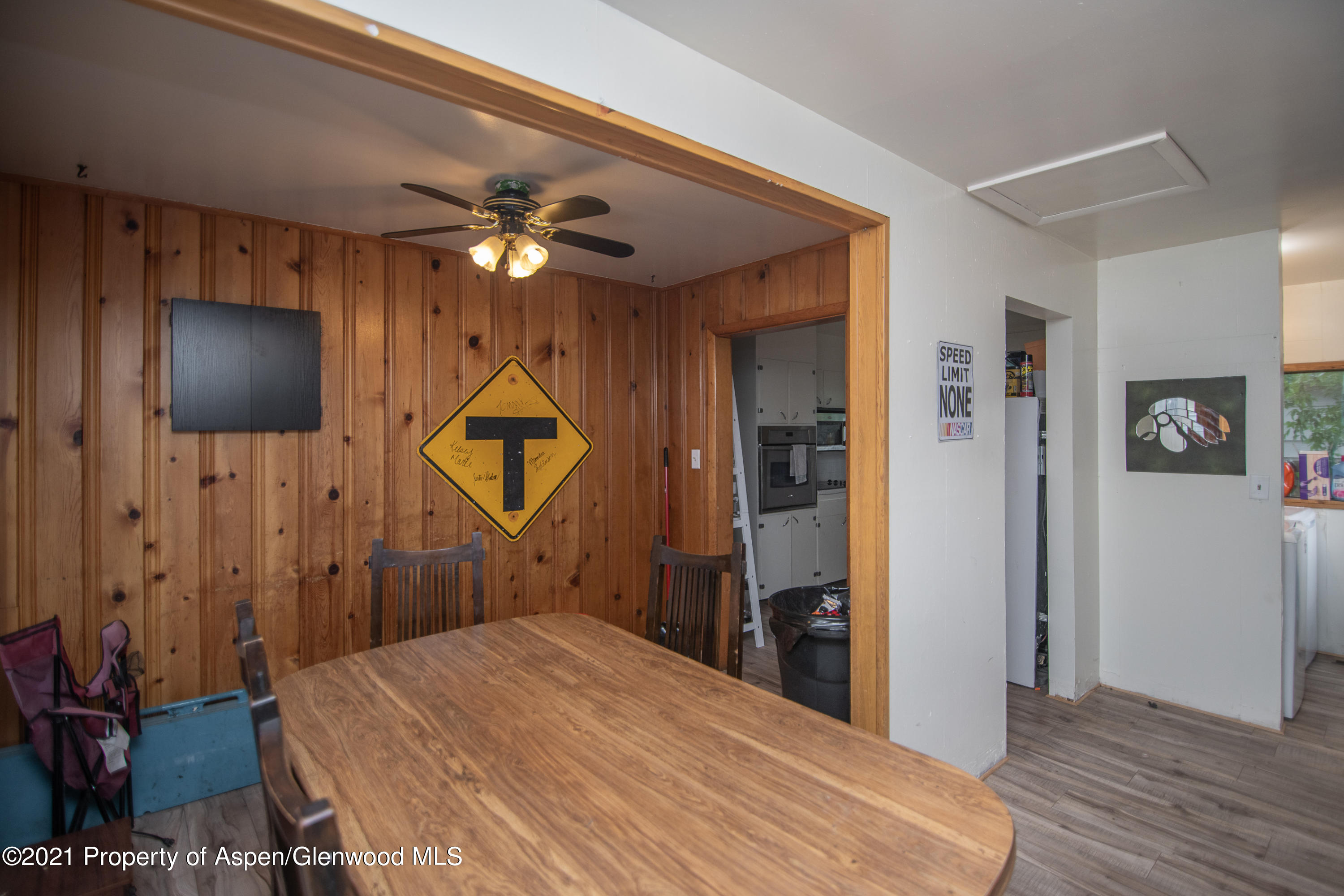 761 Rose Street Craig, CO 81625 - Photo 11 of 42 a bedroom with a bed and a chandelier