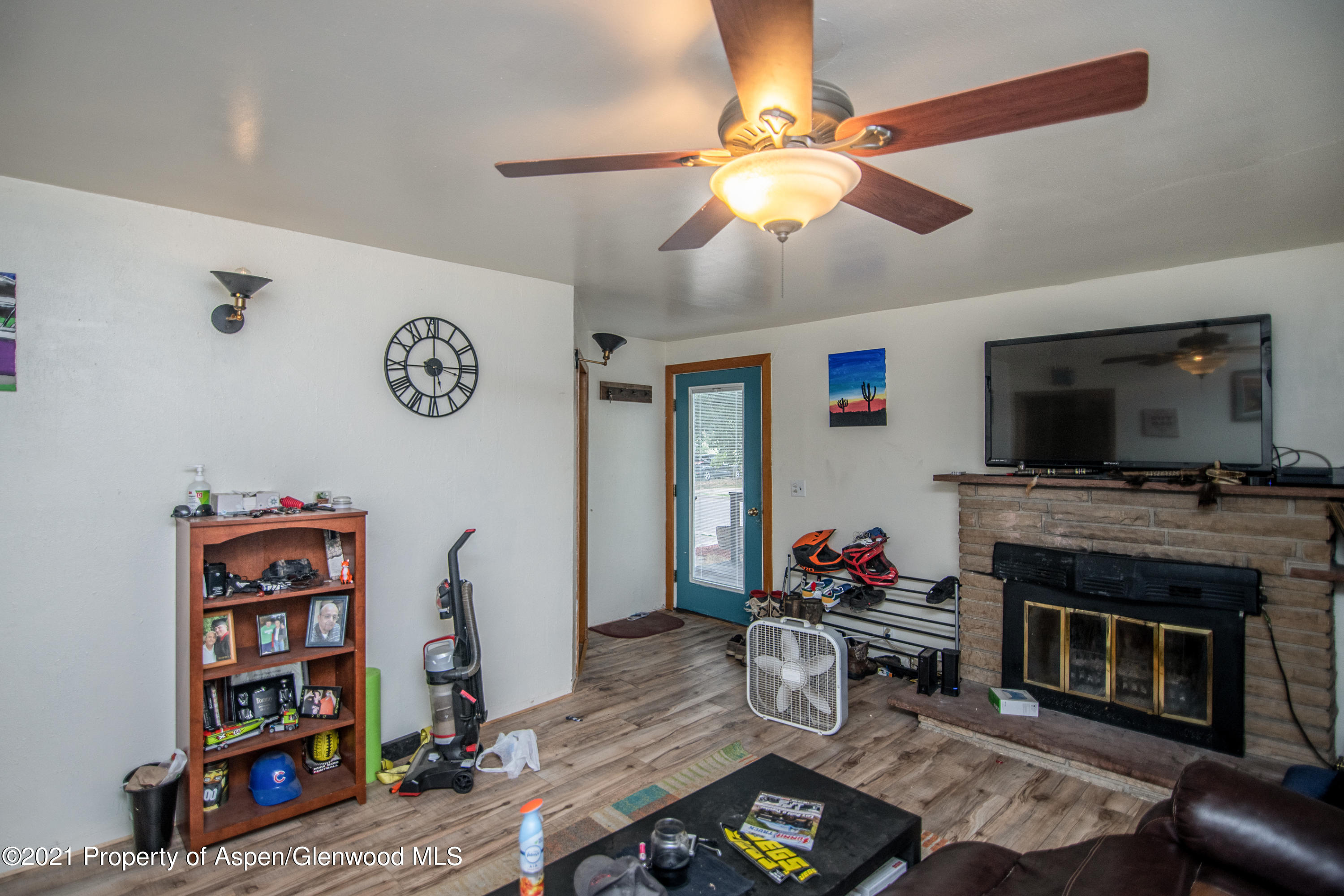761 Rose Street Craig, CO 81625 - Photo 19 of 42 a living room with furniture and a flat screen tv