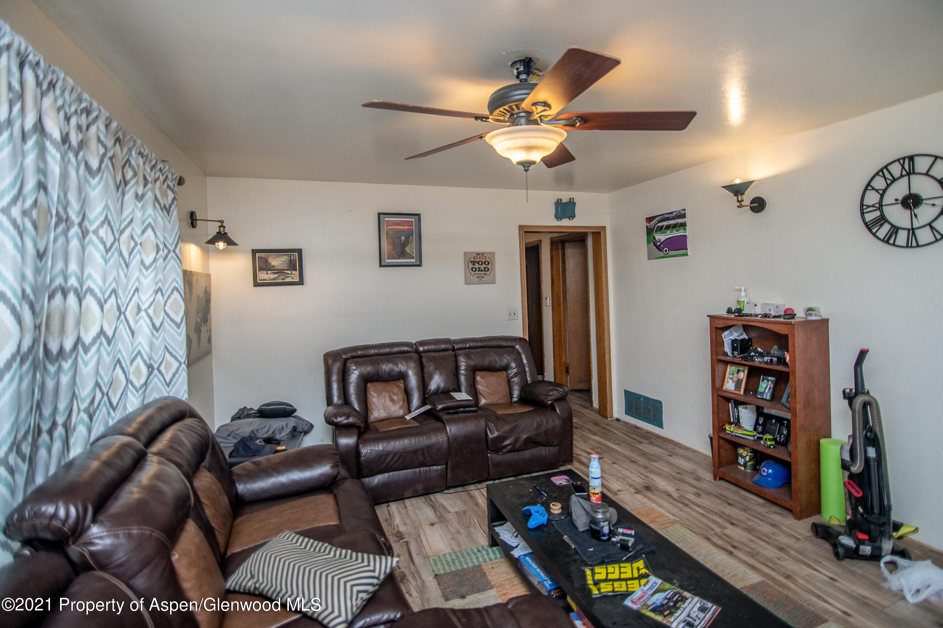 761 Rose Street Craig, CO 81625 - Photo 20 of 42 a living room with furniture and a flat screen tv