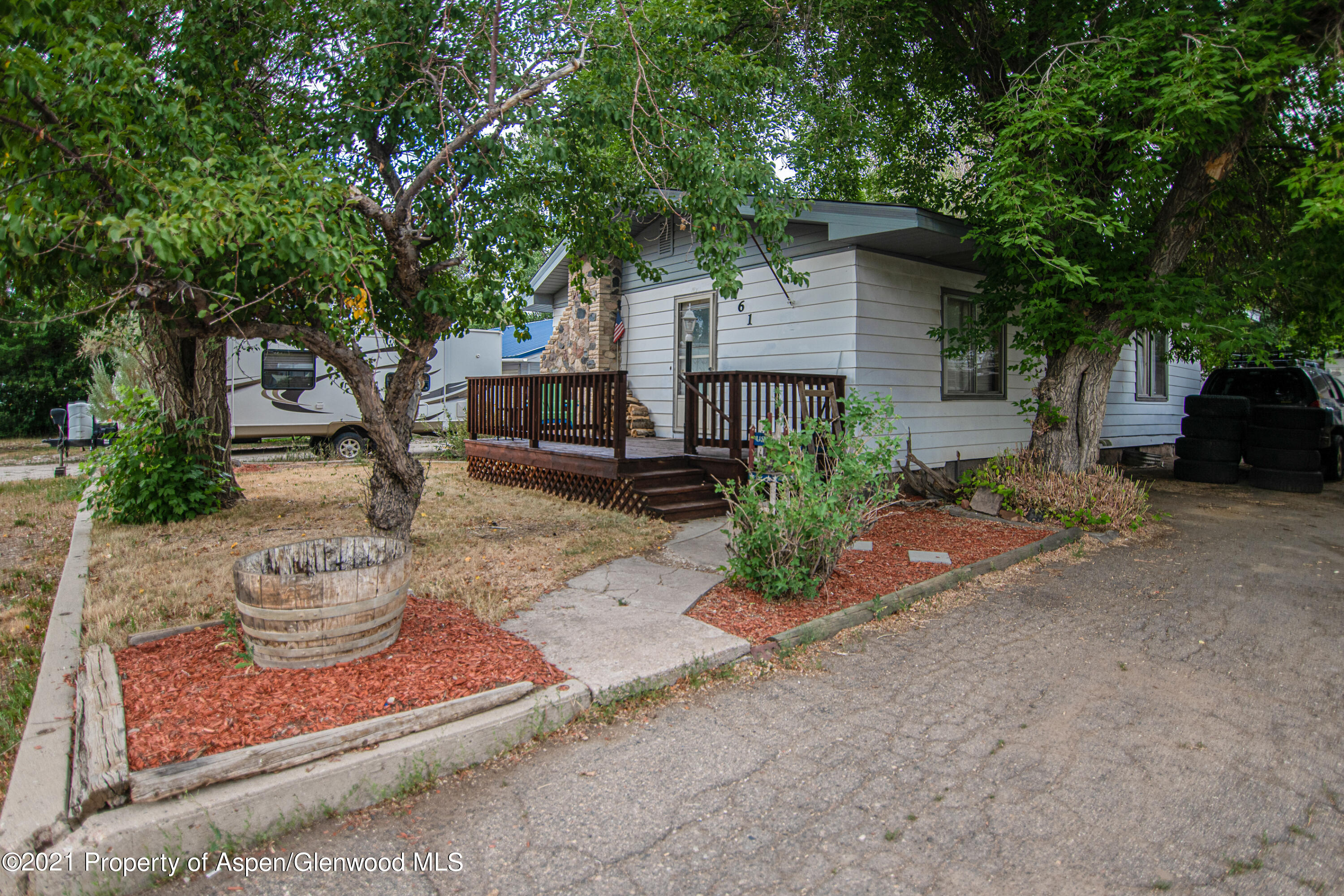 761 Rose Street Craig, CO 81625 - Photo 2 of 42 a front view of a house with garden