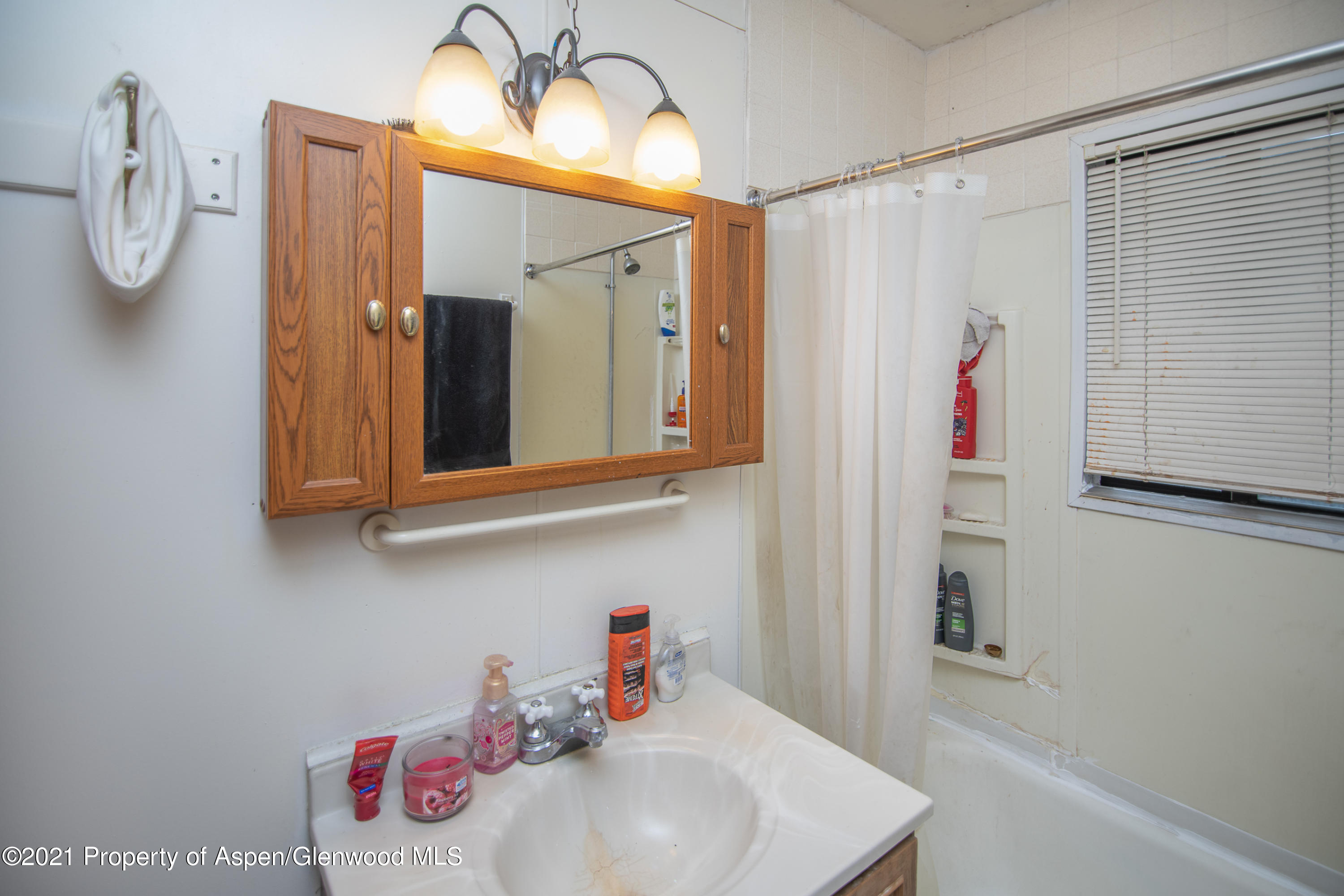761 Rose Street Craig, CO 81625 - Photo 22 of 42 a bathroom with a sink and a mirror