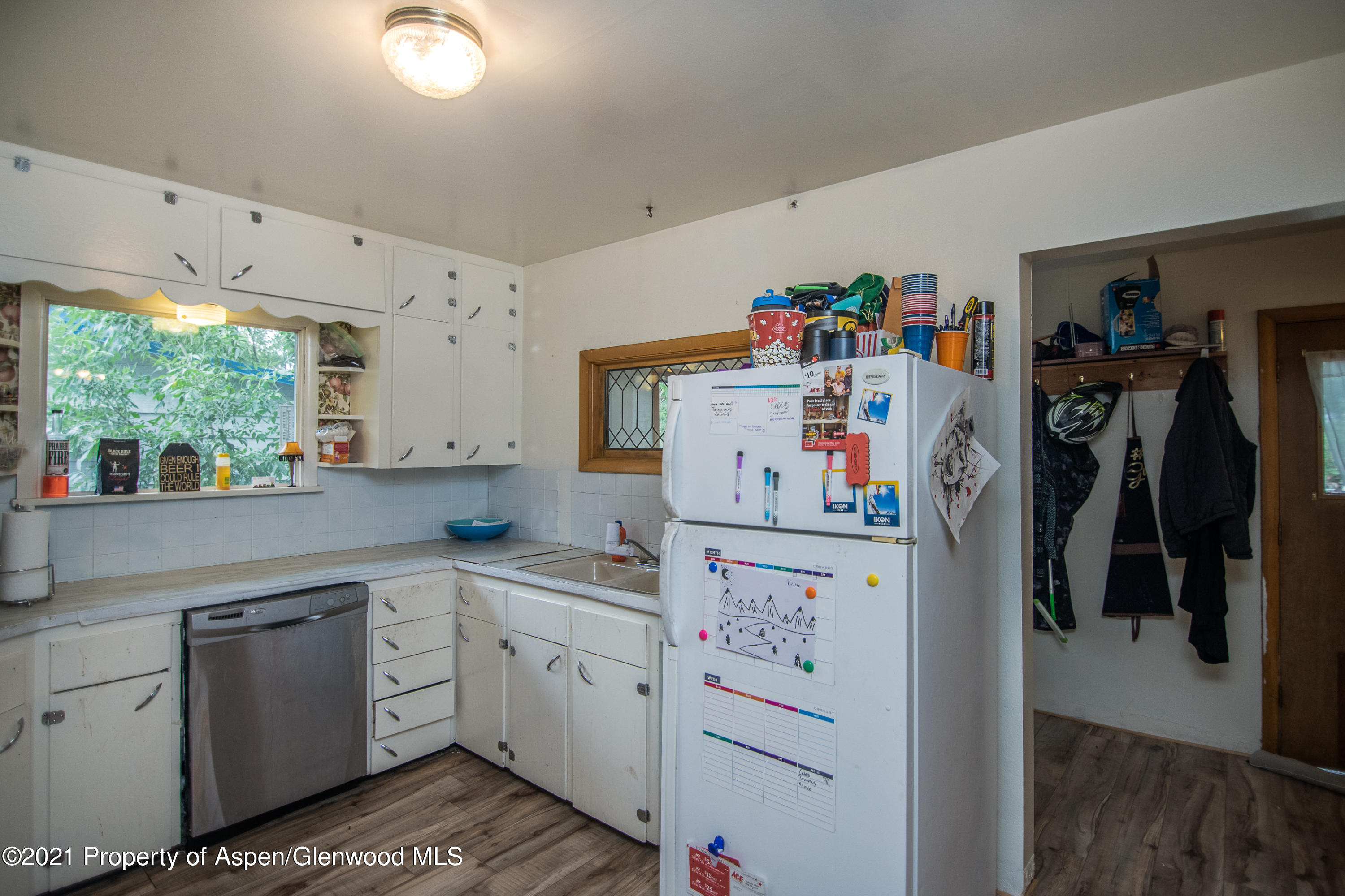 761 Rose Street Craig, CO 81625 - Photo 27 of 42 a utility room with cabinets washer and dryer