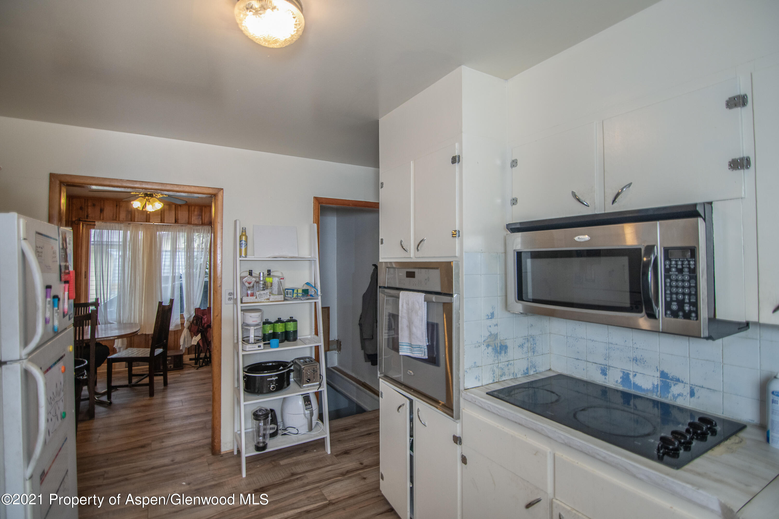 761 Rose Street Craig, CO 81625 - Photo 28 of 42 a kitchen with stainless steel appliances a stove a sink and a microwave