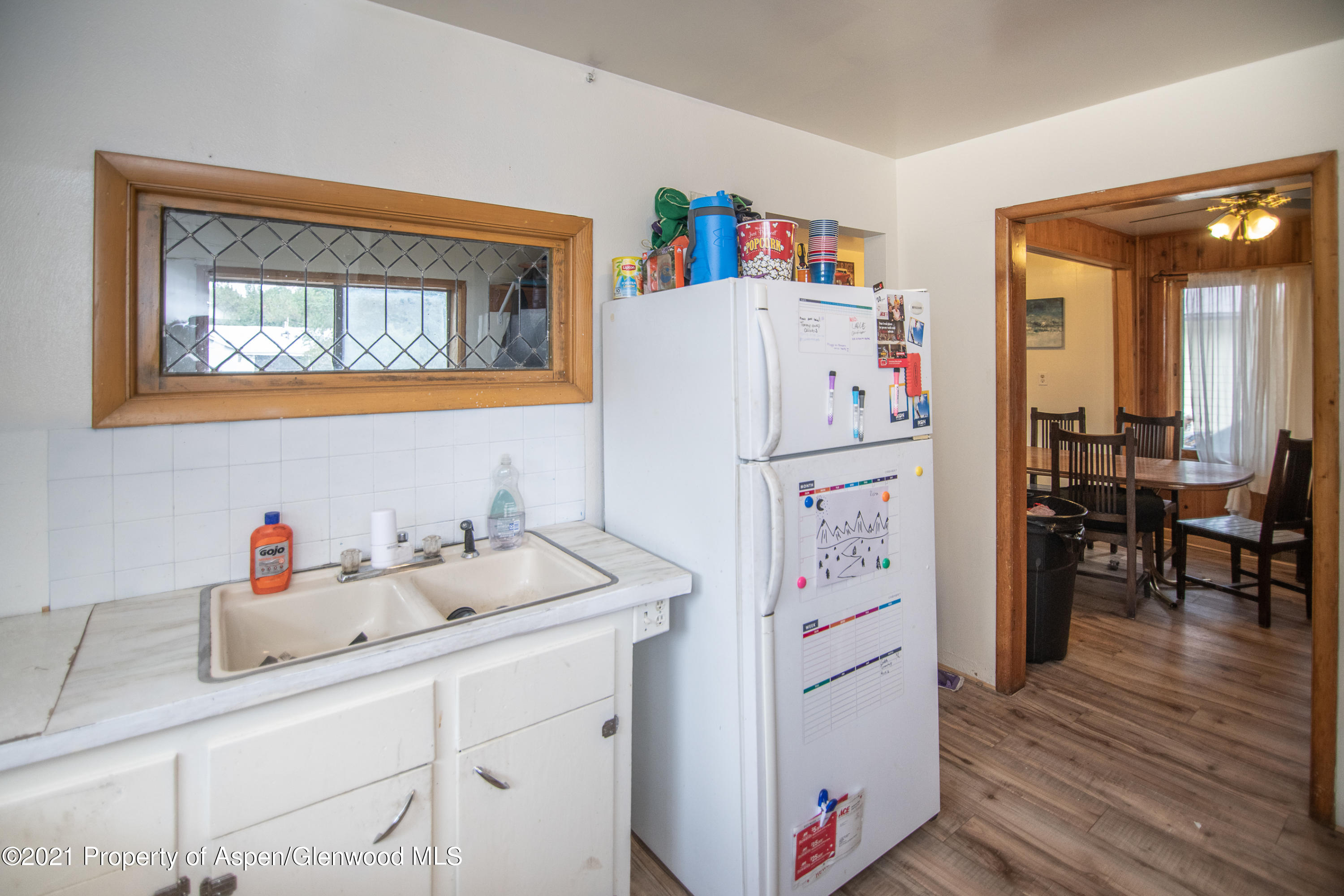 761 Rose Street Craig, CO 81625 - Photo 29 of 42 a white refrigerator freezer sitting inside of a kitchen