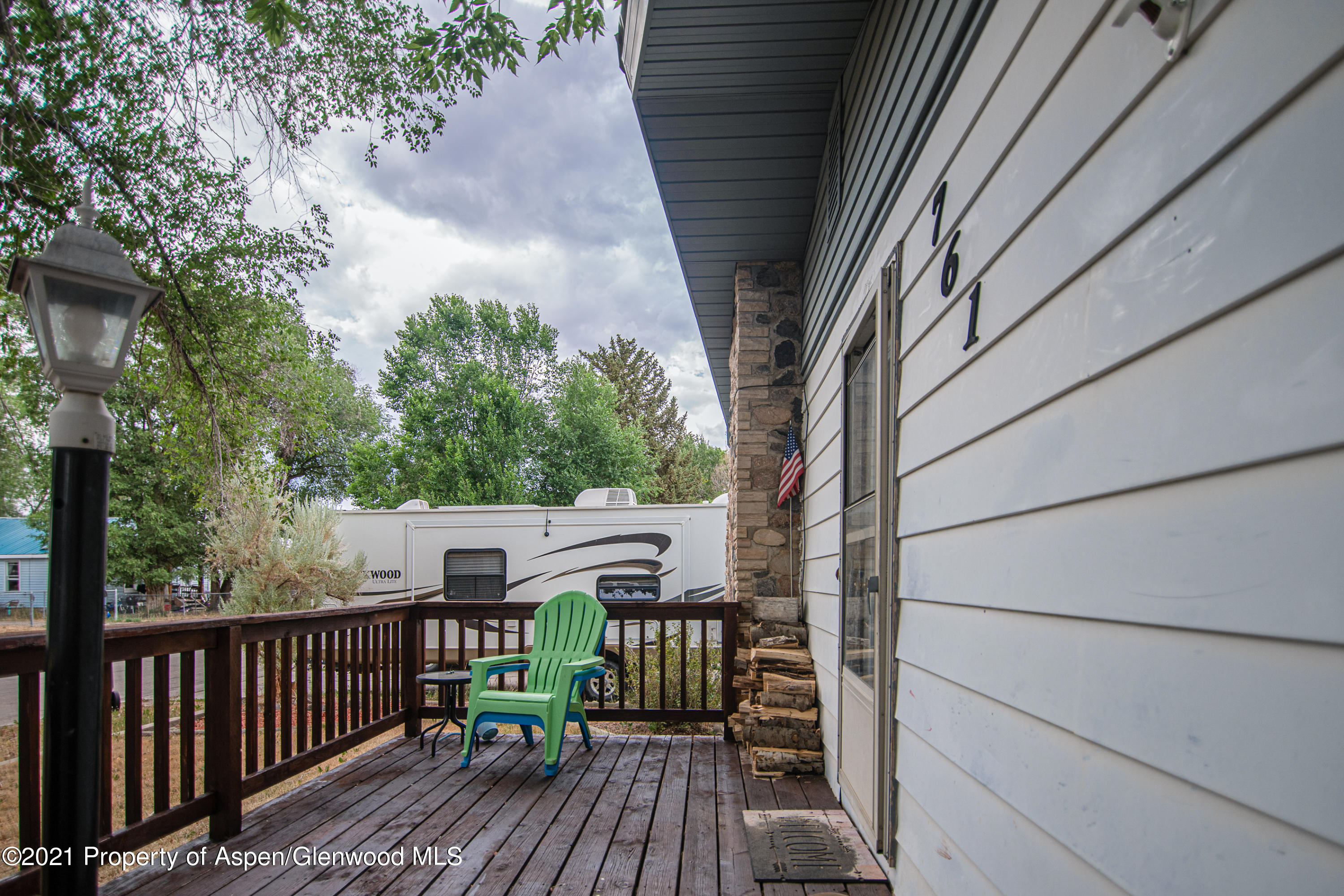 761 Rose Street Craig, CO 81625 - Photo 3 of 42 a view of balcony with wooden floor and fence